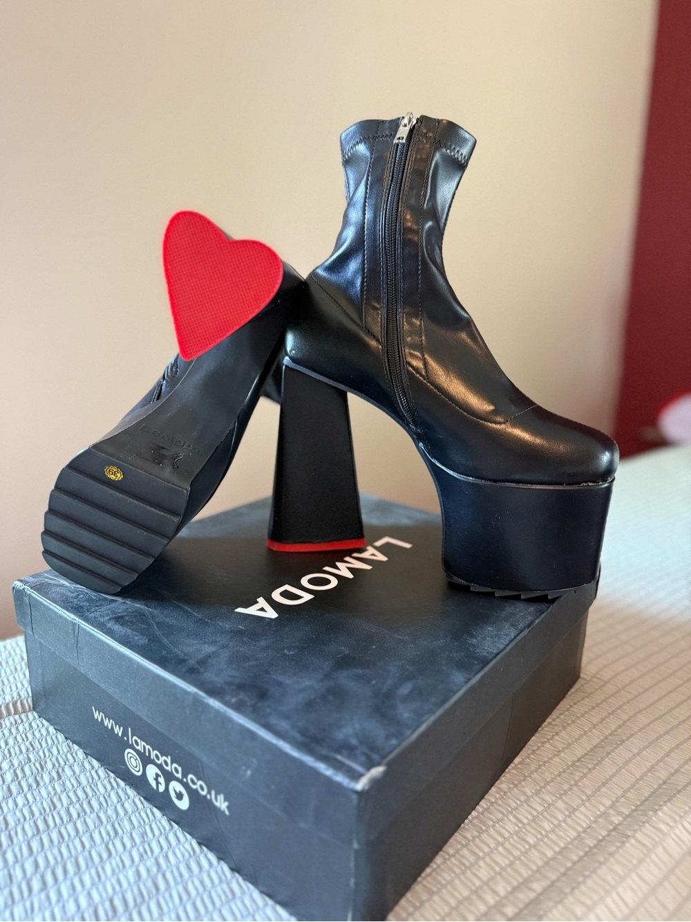 LAMODA Black Platform Ankle Boots with Red Heart Sole Accent